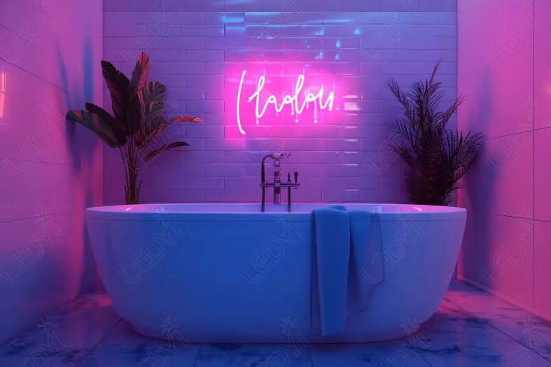 Modern bathroom with neon sign and plants.