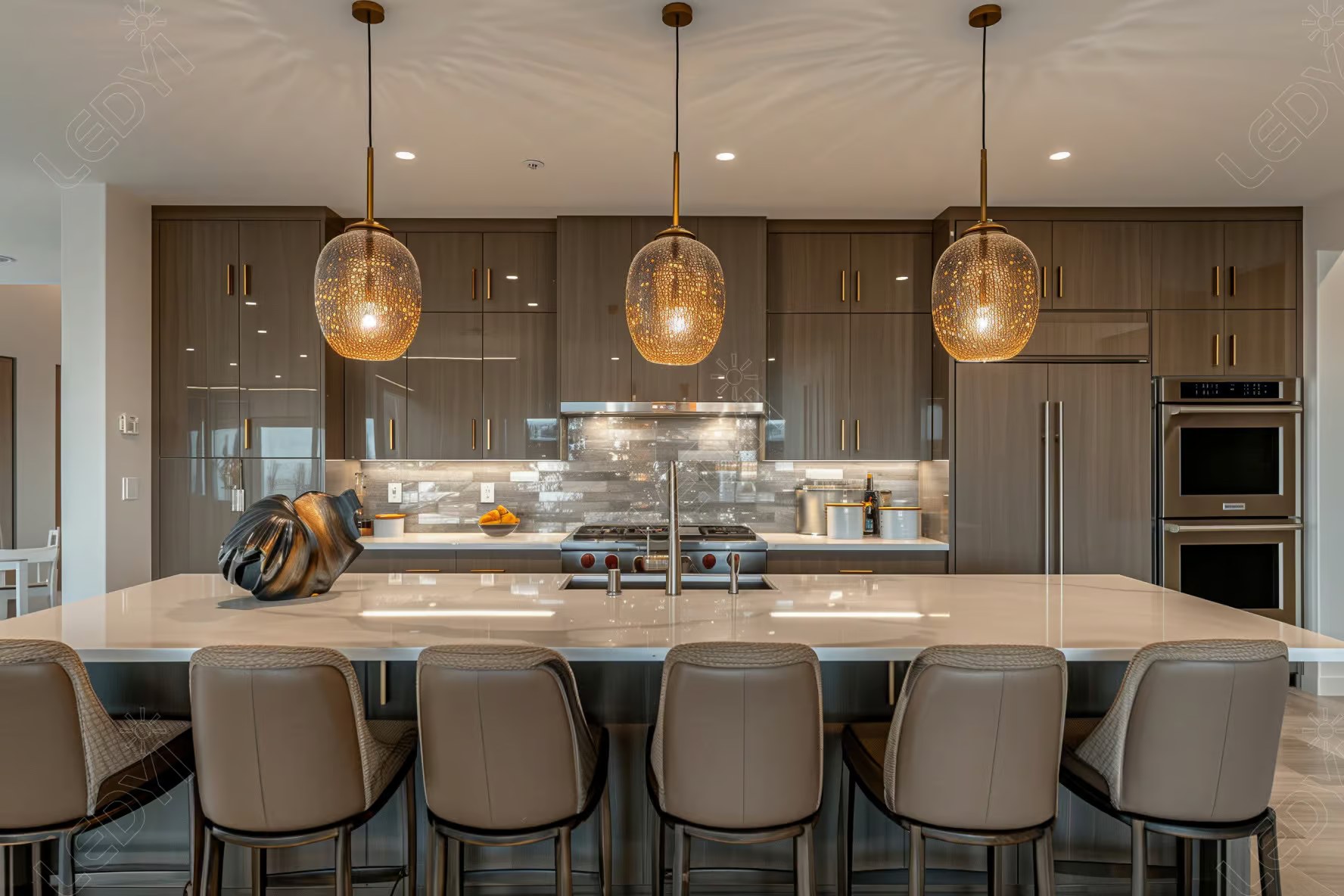 Modern kitchen with island, pendant lights, and sleek cabinetry.