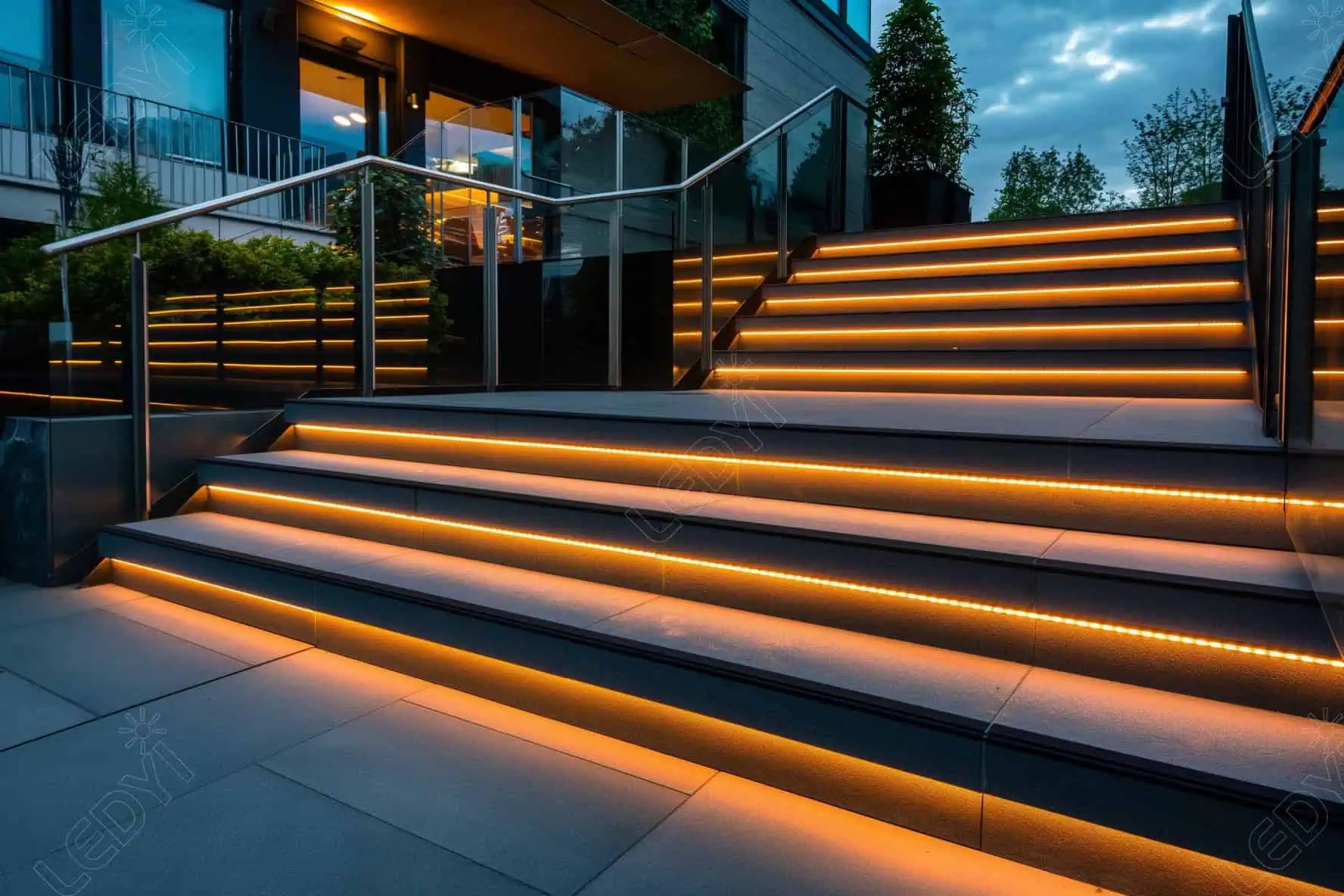 Modern LED-lit outdoor staircase at night.