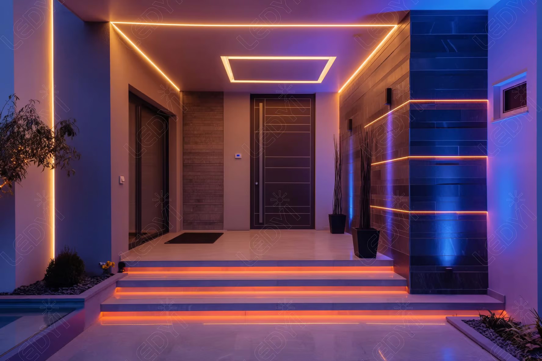 Modern entrance with colorful LED lighting.